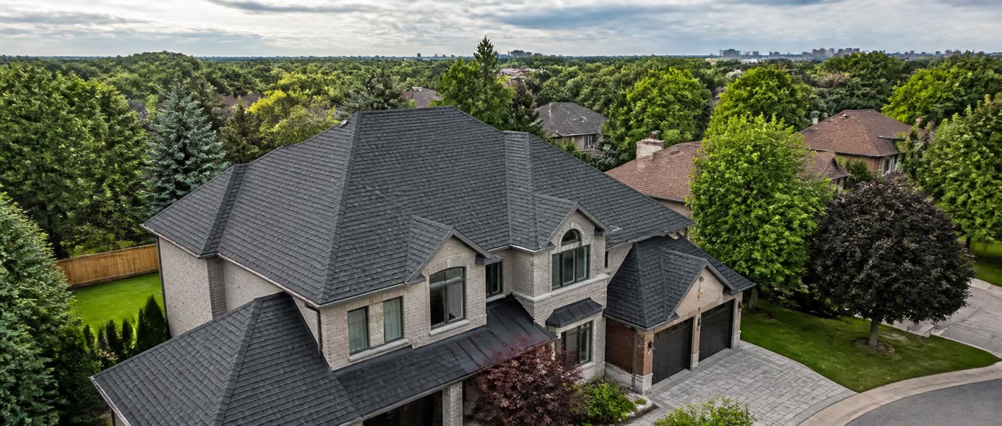 Suburban two-storey Toronto home with a newly installed dark grey architectural asphalt shingle roof